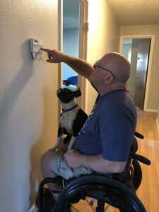 Travis and Candi looking at thermostat