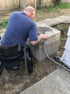 Travis looking at old AC